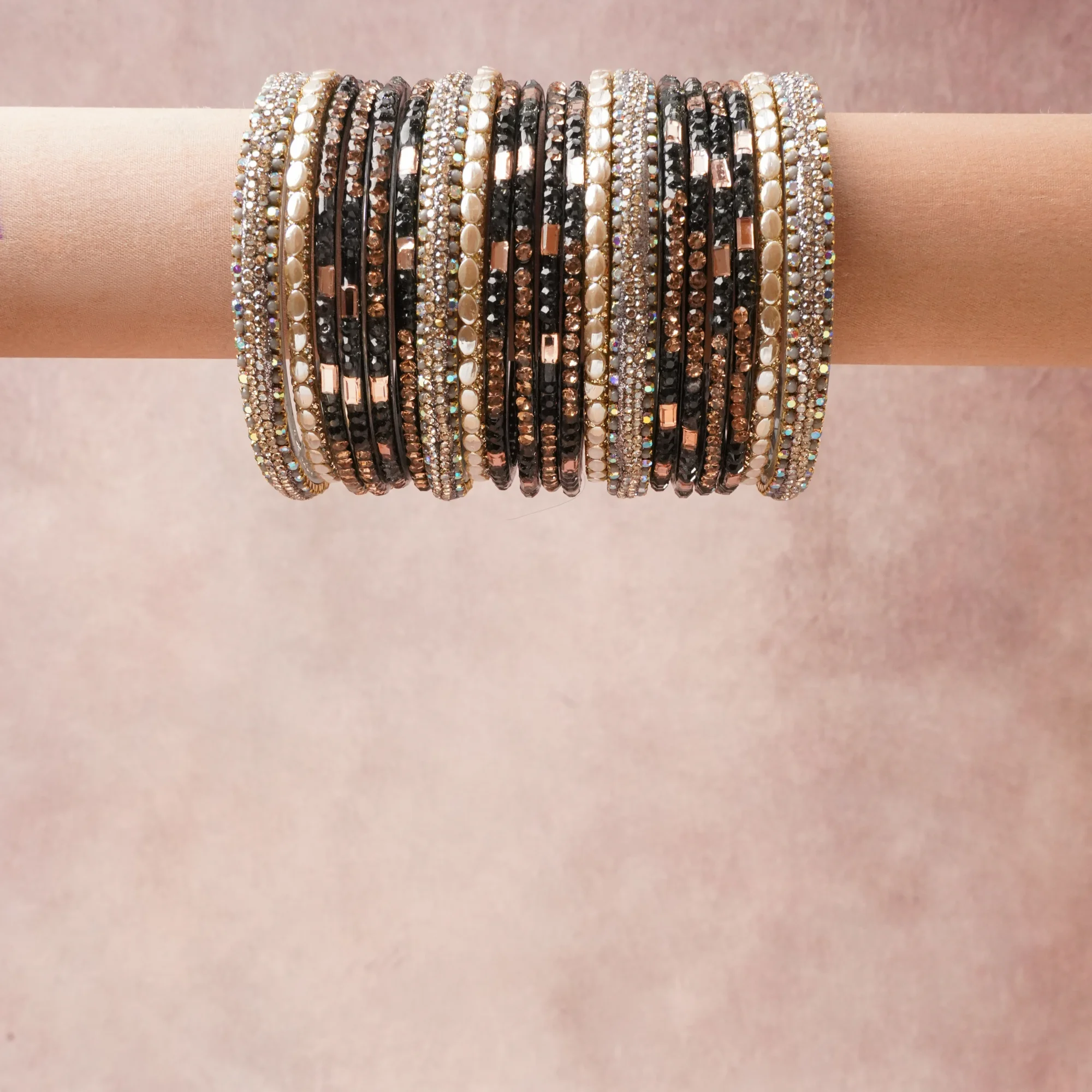 A commanding Deep Jet Black anchors this beautiful set, enriched with accents of Clear Iridescent, Rose Gold, Cream Pearl that add depth and dimension.

Featuring a striking composition of Metal Alloy, Faceted Glass Crystals, Faux Pearls, Resin, this set carries intricate craftsmanship and strong presence. Grand in form, it is created for moments that deserve to be marked.